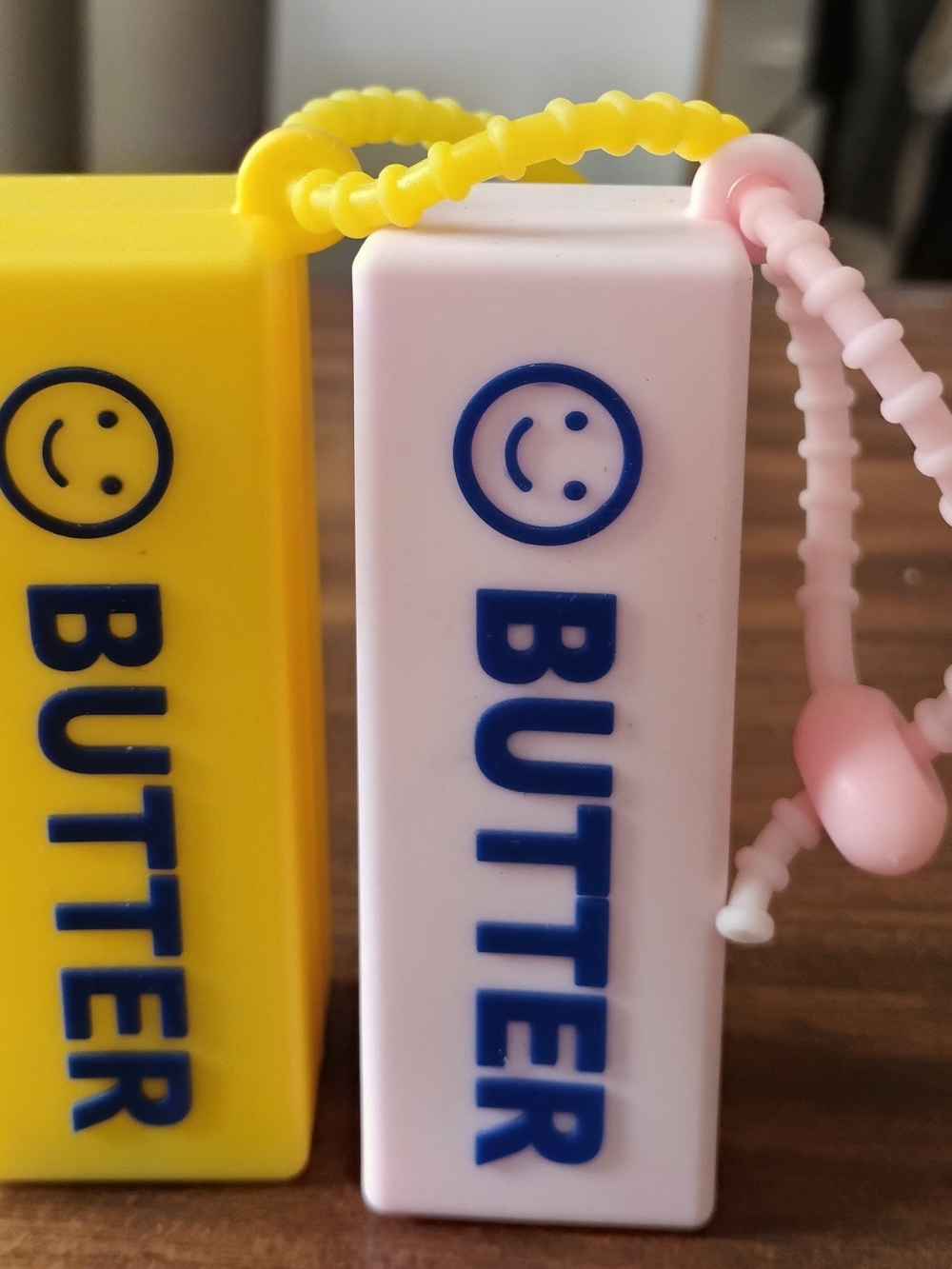 Butter Smiley Keychain Duo in Yellow and Pink